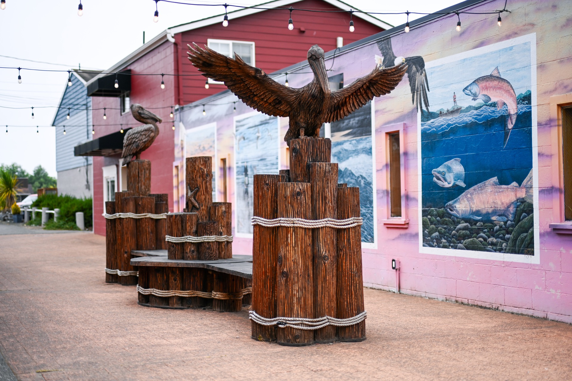 Pelican sculptures and mural